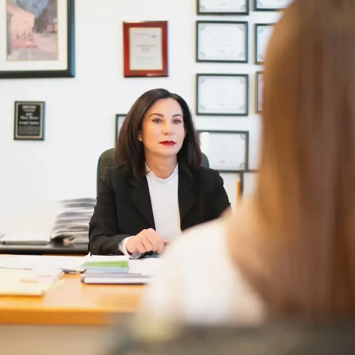 Lena Polnet, founder of Dynamic Funding Solutions, meeting with a home loan client at her desk in Huntingdon Valley